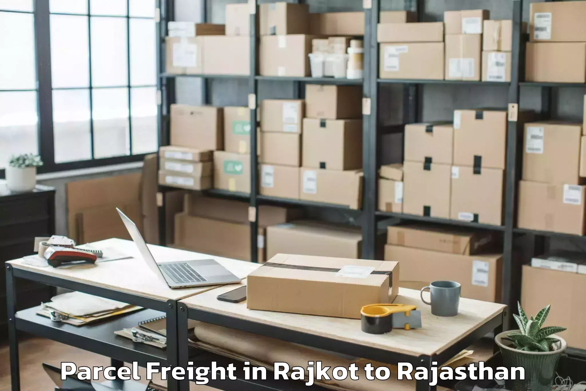 Top Rajkot to Jaipur National University Jai Parcel Freight Available